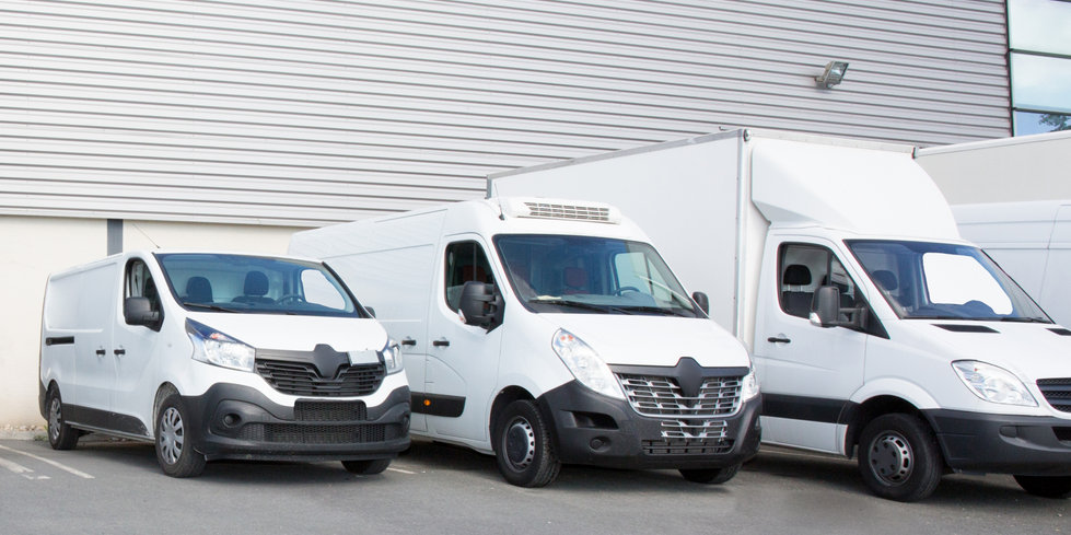 specialized delivery society parking with small trucks and van